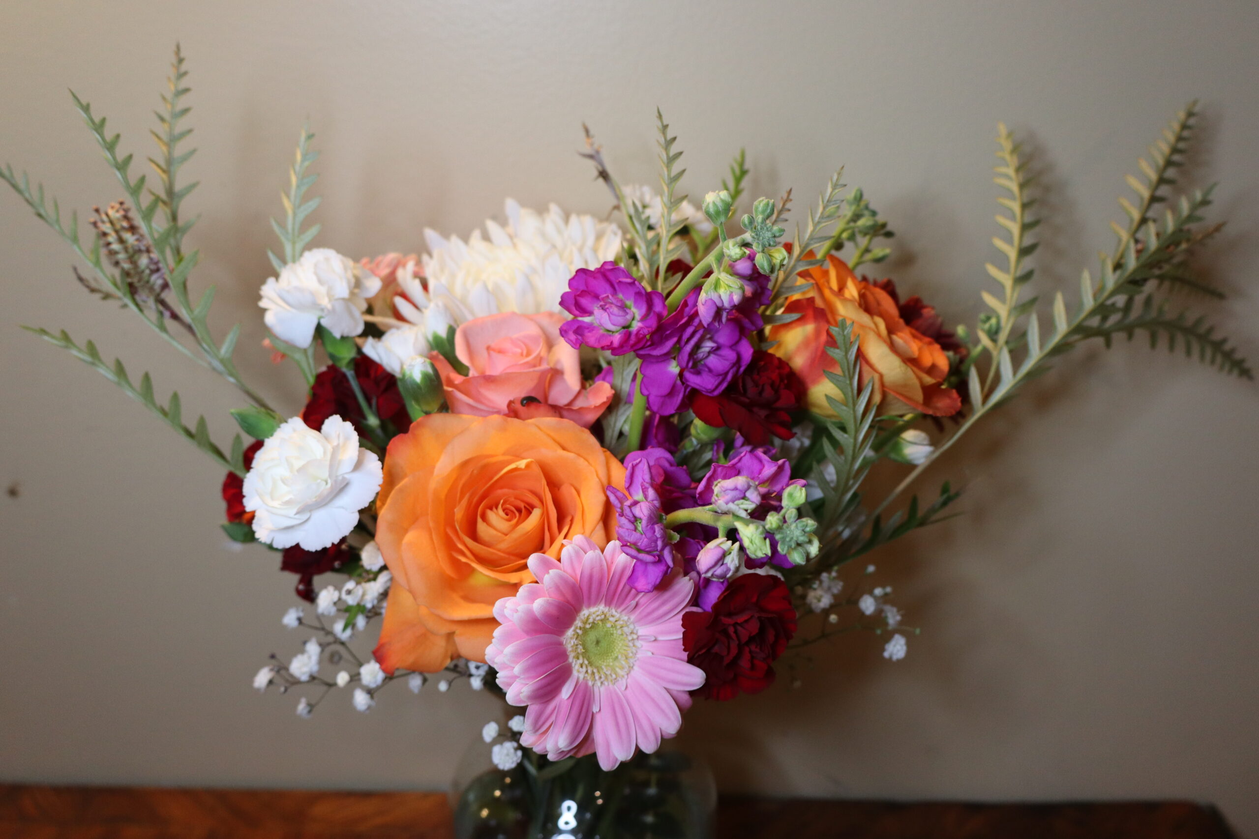 Close up of a vibrant floral centerpiece.