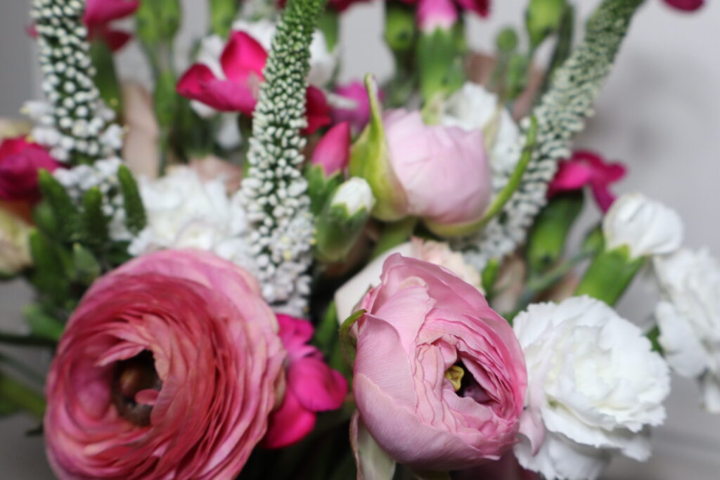 Close up of flowers in a floral arch.
